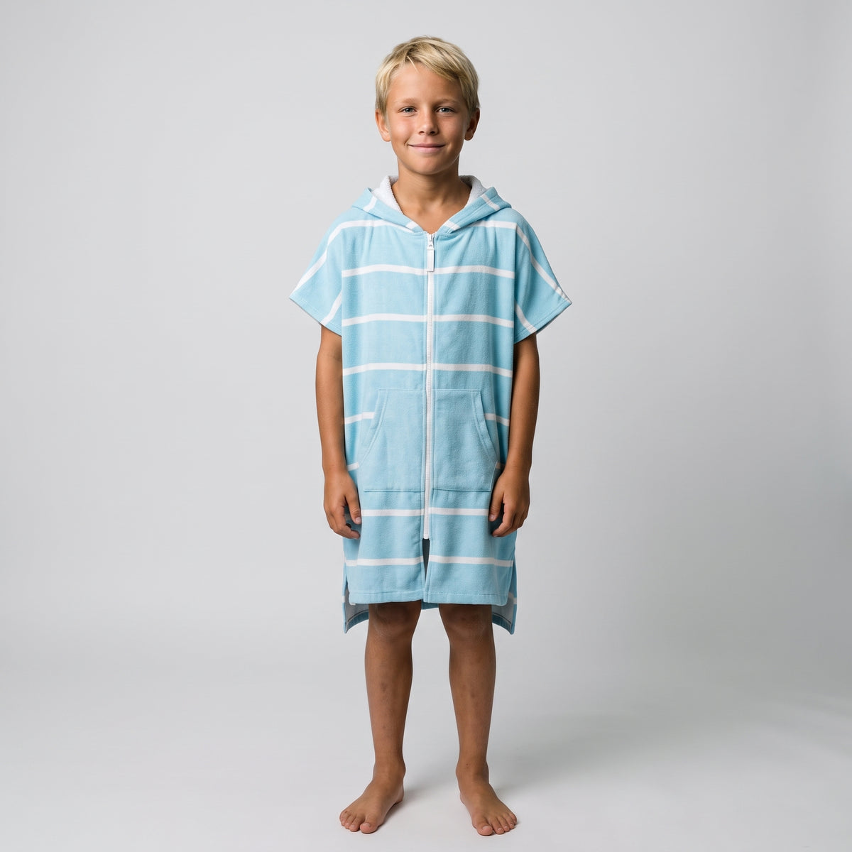 Boy in the Amalfi aqua and white kids zip hooded towel, studio photo, front view