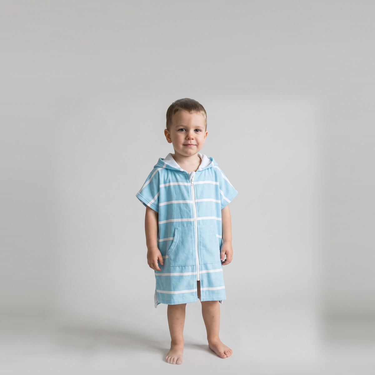 Toddler boy in the Amalfi aqua and white toddler zip hooded towel, studio photo, front view
