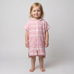 Amalfi toddler hooded towel in pink and white stripes worn by a toddler girl, studio photo, front view