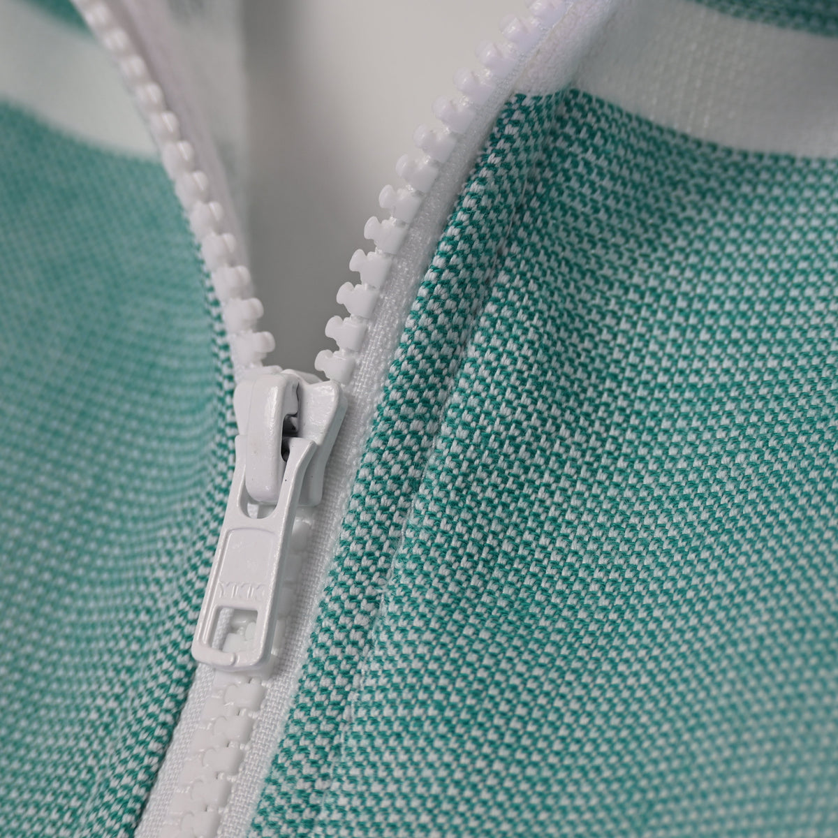 Close-up of the Amalfi Teal White Turkish hooded towel front zip and textured cotton weave