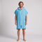 Man wearing the Santorini Aqua hooded towel, front view on a plain studio background
