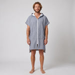 Man wearing the Santorini Navy Turkish hooded towel, front view on a plain studio background