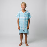 Boy in the Amalfi aqua and white kids zip hooded towel, studio photo, front view
