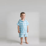 Toddler boy in the Amalfi aqua and white toddler zip hooded towel, studio photo, front view