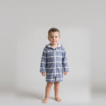 Toddler boy in the long sleeve Amalfi navy and white toddler hooded towel, studio front view