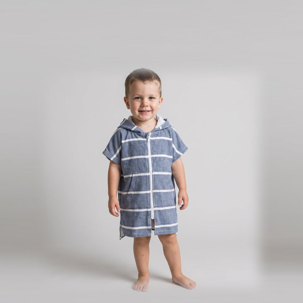 Toddler boy in the Amalfi navy and white toddler zip hooded towel, studio photo, front view