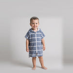 Toddler boy in the Amalfi navy and white toddler zip hooded towel, studio photo, front view
