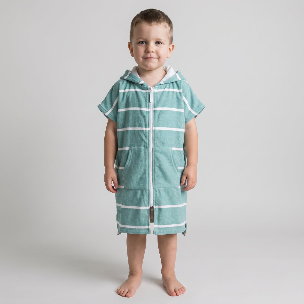 Amalfi toddler hooded towel in teal and white stripes worn by a toddler boy, studio photo, front view