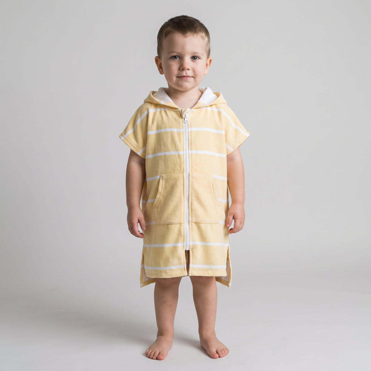 Toddler boy in the Amalfi yellow and white toddler zip hooded towel, studio photo, front view