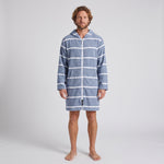Long sleeve Amalfi adult hooded towel in navy and white stripes worn by a man, studio front view