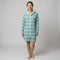 Woman in the long sleeve Amalfi teal and white striped adult hooded towel, studio front view