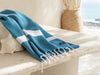 Sydney Teal Turkish towel displaying its geometric artisan weave in a coastal studio