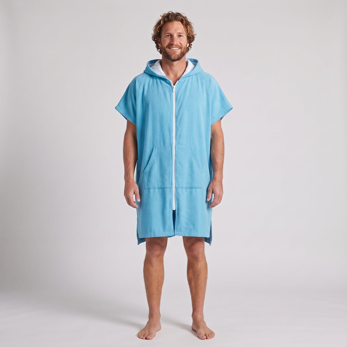 Man wearing the Santorini Aqua hooded towel, front view on a plain studio background